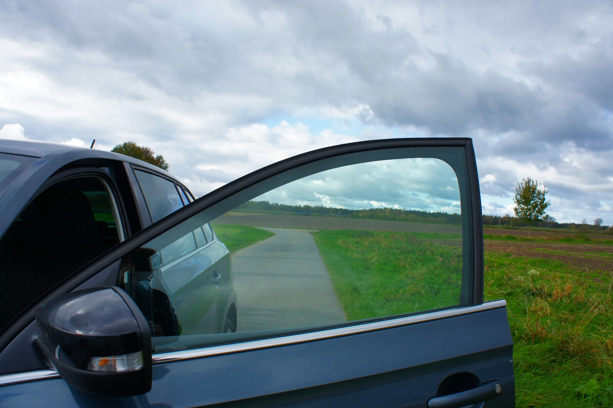 Close-up of car against sky