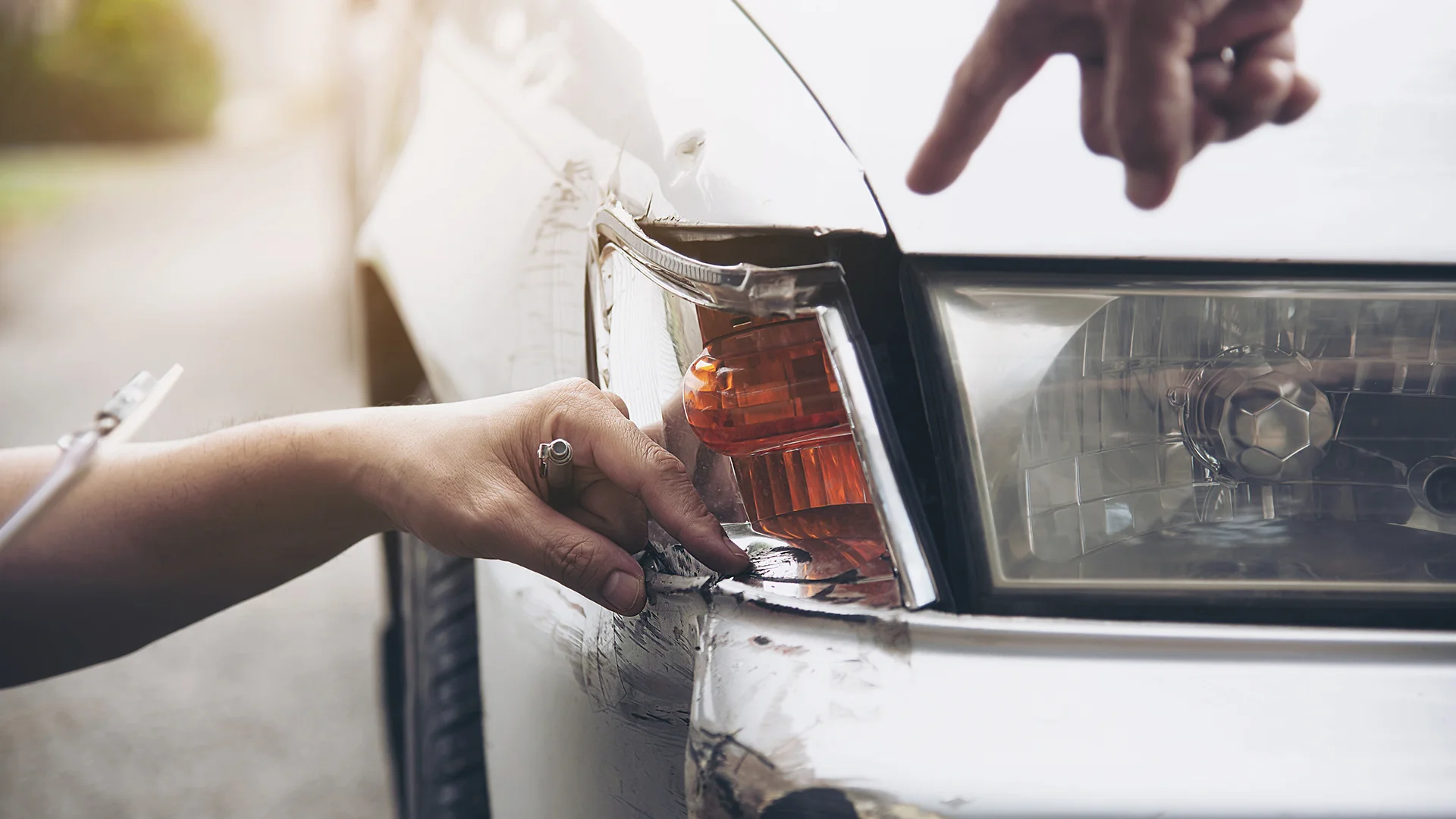 Insurance agent working during on site car accident